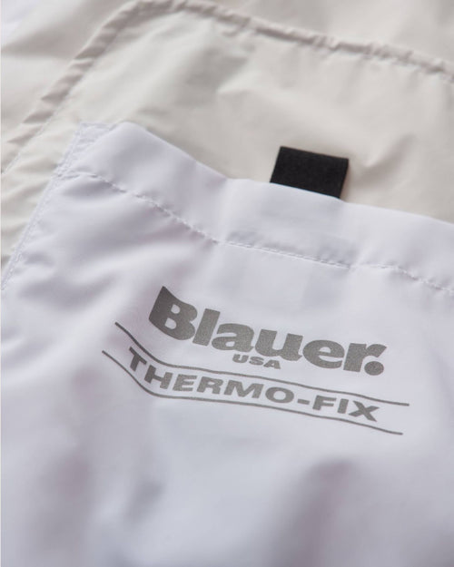 Blauer Giubbino con cappuccio antivento